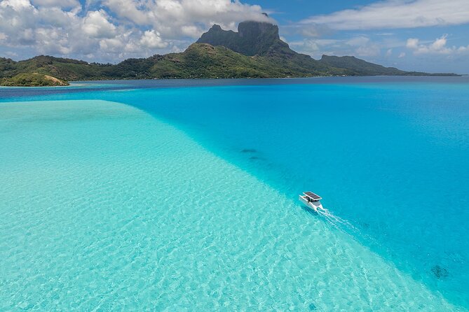 Bora Bora Private Solar Boat Experience - Stop one: meeting manta rays in open lagoon water