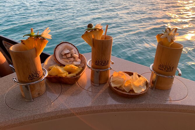 Moorea Sunset Boat Tour - Passing Opunohu Bay with a drink in hand