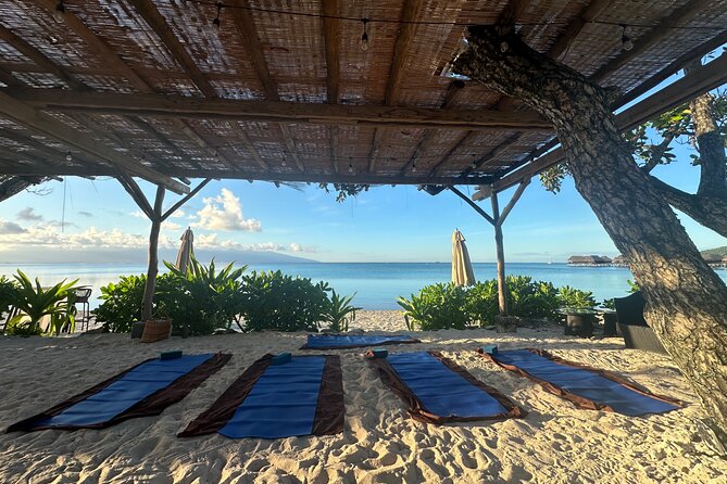 Yoga at sunrise at Sofitel Moorea, overlooking Tahiti - A sunrise practice beside Sofitel Moorea